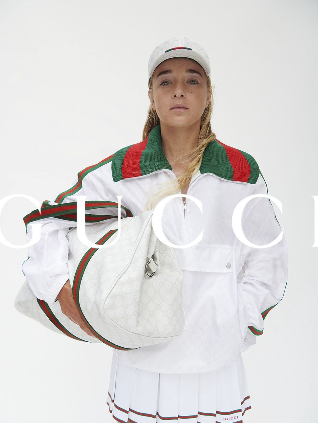 Gucci's new Tennis Special Collection blends 1970s nostalgia with modern elegance, featuring tennis players Emma Cohen and George Loffhagen. The collection, now available globally, includes reimagined attire and iconic accessories.