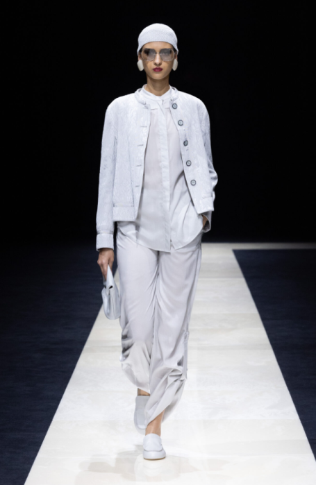 Emporio Armani’s SS25 collection redefined women’s tailoring with soft, elegant silhouettes and gender-fluid designs. Classic suits were tra