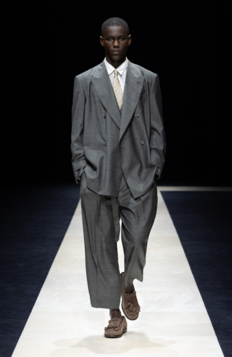 Emporio Armani’s SS25 collection redefined women’s tailoring with soft, elegant silhouettes and gender-fluid designs. Classic suits were tra